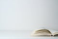 Open book on the table. A book with a white page on a light empty background. Education, school, study, reading concept Royalty Free Stock Photo