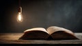 Open Book Under Hanging LightâSymbol of Knowledge, Study, and Enlightenment Royalty Free Stock Photo