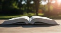 Open Book on Wooden Table Outdoors with Sunlight Royalty Free Stock Photo