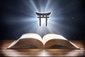 Open book on wooden table and shintoism symbol front view Royalty Free Stock Photo