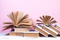 Open books, hardback colorful books on wooden table. pink background. Back to school. Copy space for text. Education business Royalty Free Stock Photo