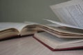 Open books lying on the table