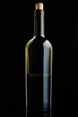 open Bottle of red Wine. Half a Bottle of Wine. A Bottle of Wine on a black background. Bottle with a cork isolated on a black bac