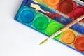 Open box with water colors and a brush Royalty Free Stock Photo