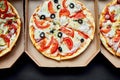 Open boxes with hot tasty italian sliced pizzas on black background Royalty Free Stock Photo