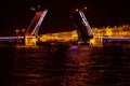 Open bridge over the river in the evening city. Drawbridge in Saint Petersburg with night lights