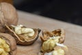 Open and broken walnut shells lying on the table Royalty Free Stock Photo