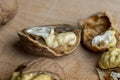 Open and broken walnut shells lying on the table Royalty Free Stock Photo