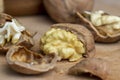 Open and broken walnut shells lying on the table Royalty Free Stock Photo