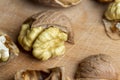 Open and broken walnut shells lying on the table Royalty Free Stock Photo