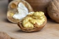 Open and broken walnut shells lying on the table Royalty Free Stock Photo