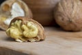 Open and broken walnut shells lying on the table Royalty Free Stock Photo