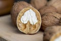 Open and broken walnut shells lying on the table Royalty Free Stock Photo