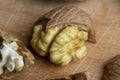 Open and broken walnut shells lying on the table Royalty Free Stock Photo