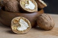 Open and broken walnut shells lying on the table Royalty Free Stock Photo