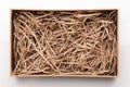 Open brown box with shredded paper Royalty Free Stock Photo