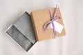 Open brown gift square craft box with ribbon, mockup tag, price tag. Paper for packaging clothes