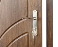 Open brown wooden door handle with lock. Royalty Free Stock Photo