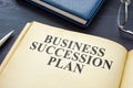 Open business succession plan on the wooden surface. Royalty Free Stock Photo