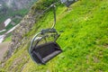 Open cabin lift cable car in the mountains in summer