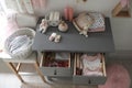 Cabinet drawers with baby shoes and clothes in child room Royalty Free Stock Photo