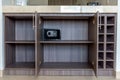 Open cabinet with shelves and electronic safe Royalty Free Stock Photo