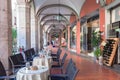 An open cafe in the gallery on street of Pisa