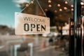 Open sign board on glass door in modern cafe coffee shop Royalty Free Stock Photo