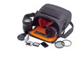 Open camera bag, photo lenses and some photo accessories Royalty Free Stock Photo