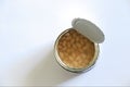 Open can with canned beans on white top view Royalty Free Stock Photo