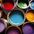 Open cans of paint in many colors, representing diversity and choice Royalty Free Stock Photo