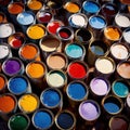 Open cans of paint in many colors, representing diversity and choice Royalty Free Stock Photo