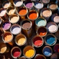 Open cans of paint in many colors, representing diversity and choice Royalty Free Stock Photo