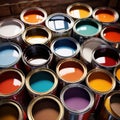 Open cans of paint in many colors, representing diversity and choice