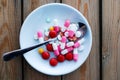 various pills in a white plate on wood background Royalty Free Stock Photo