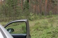 Open Car Door at Forest Edge Royalty Free Stock Photo