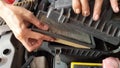 open the car engine filter to clean, make the car engine more maintained