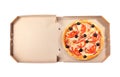 Open cardboard box with delicious pizza on white background, top view. Royalty Free Stock Photo