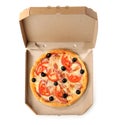 Open cardboard box with delicious pizza on white background, top view. Royalty Free Stock Photo