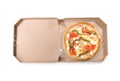 Open cardboard box with delicious pizza on white, top view. Food delivery Royalty Free Stock Photo