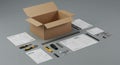 Open cardboard box surrounded by assembly instructions, tools, and components. Royalty Free Stock Photo