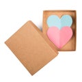Open cardboard box with two paper hearts isolated on white background Royalty Free Stock Photo