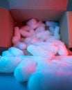Open cardboard box with white styrofoam filling pieces comming out, parcel packing materials, safe and secure shipment methods, Royalty Free Stock Photo