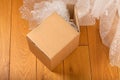 Cardboard box on a wooden floor Royalty Free Stock Photo