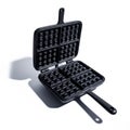 Open Cast Iron Waffle Maker with Double Handle and Dramatic Shadow on White Royalty Free Stock Photo