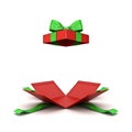 Open christmas gift box or red present box with green ribbon bow isolated on white background Royalty Free Stock Photo