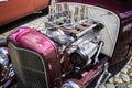 Open chrome engine bay of a hot rod fun car with six cylinders and single carburetors Royalty Free Stock Photo