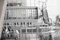 Open clean empty dishwasher in kitchen, closeup Royalty Free Stock Photo