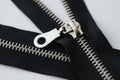 Open and closed metal zippers for clothing on white background Royalty Free Stock Photo