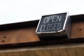 Open closed sign hanging from chain on old building Royalty Free Stock Photo